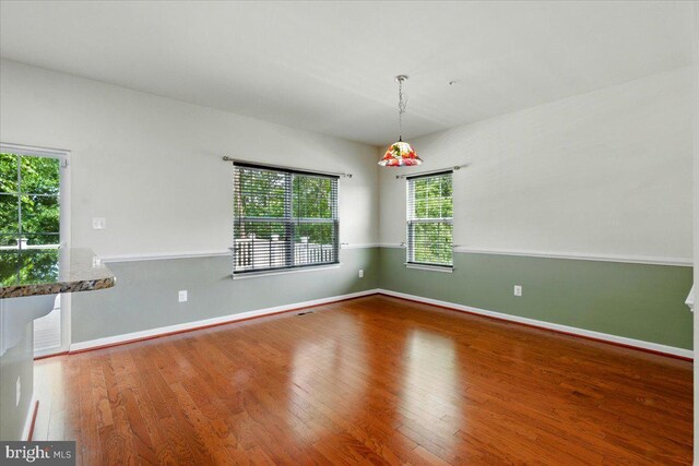 7003 Dannfield Ct, Glen Burnie, MD 21060 - unfurnished room featuring plenty of natural light and wood finished floors