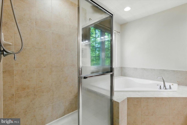 7003 Dannfield Ct, Glen Burnie, MD 21060 - bathroom featuring a shower stall, a bath, and recessed lighting