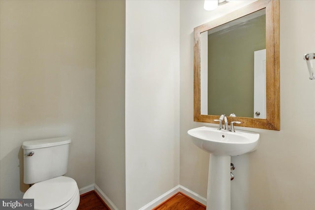 7003 Dannfield Ct, Glen Burnie, MD 21060 - half bath featuring toilet and a sink