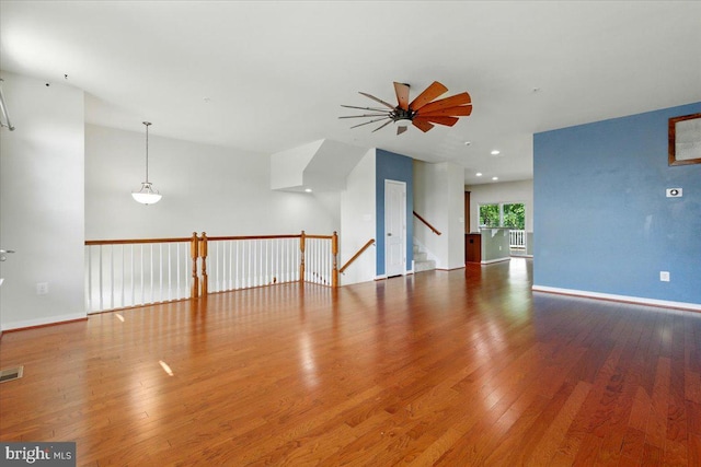 7003 Dannfield Ct, Glen Burnie, MD 21060 - unfurnished living room featuring ceiling fan and wood finished floors