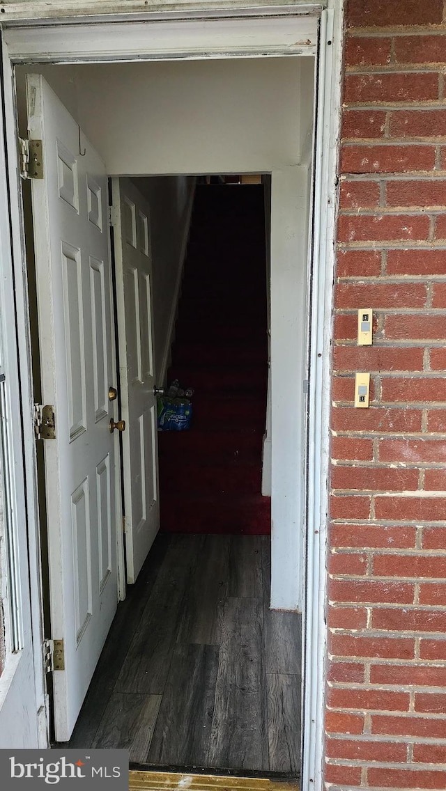 2618 E Biddle St, Baltimore, MD 21213 - hall featuring dark wood-style floors