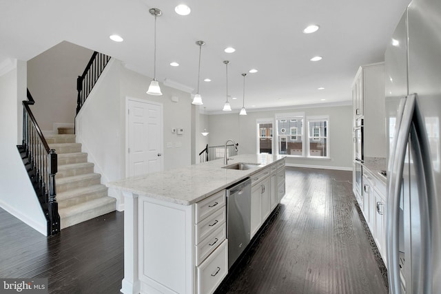 42510 Oak Park Sq, Ashburn, VA 20148 - kitchen with appliances with stainless steel finishes, ornamental molding, dark wood-style flooring, white cabinetry, and recessed lighting