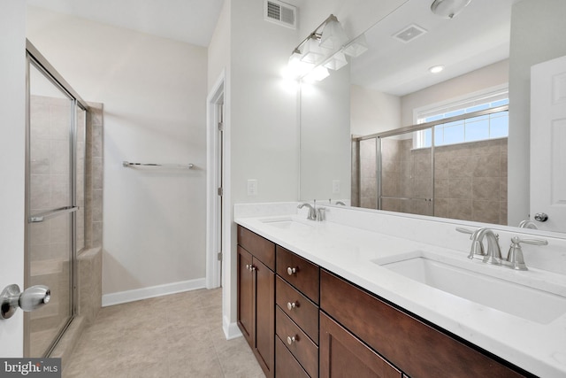 42510 Oak Park Sq, Ashburn, VA 20148 - full bathroom featuring a stall shower, double vanity, and tile patterned floors
