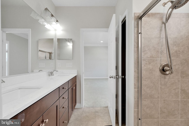 42510 Oak Park Sq, Ashburn, VA 20148 - full bath featuring double vanity, tiled shower, ornamental molding, and tile patterned floors