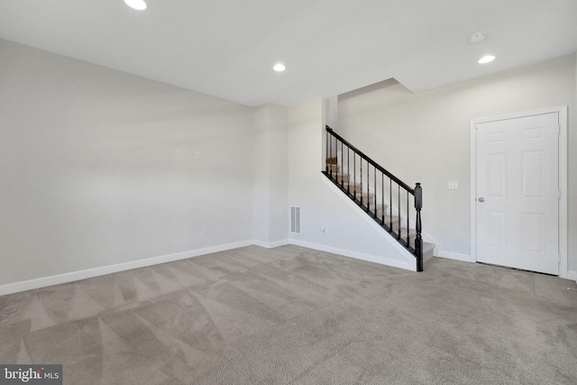 42510 Oak Park Sq, Ashburn, VA 20148 - unfurnished living room with carpet flooring, stairway, and recessed lighting
