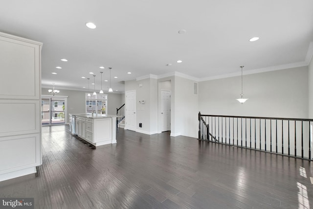 42510 Oak Park Sq, Ashburn, VA 20148 - spare room featuring crown molding, recessed lighting, dark wood-style floors, and a chandelier