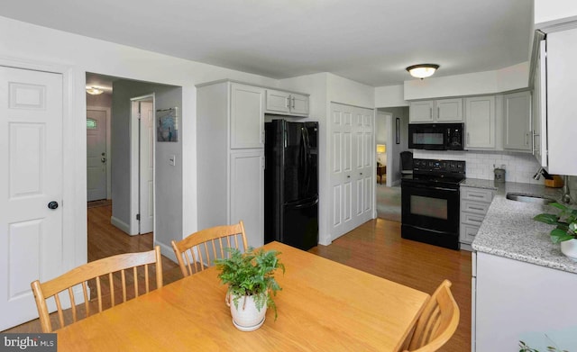 125 Christine Dr, Downingtown, PA 19335 - dining room with dark wood finished floors and baseboards