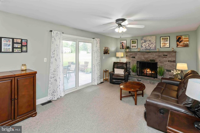 125 Christine Dr, Downingtown, PA 19335 - living room featuring a ceiling fan, a fireplace, and light carpet