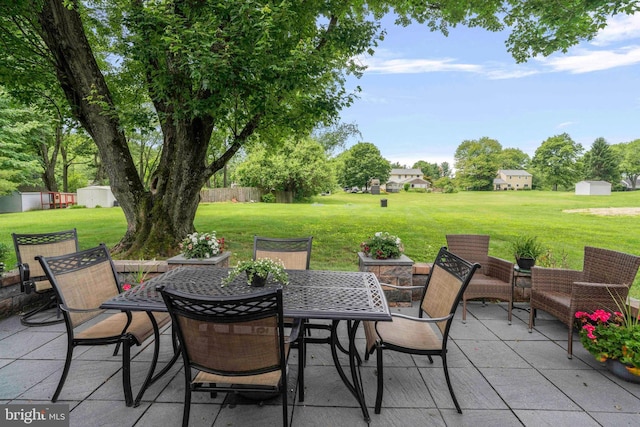125 Christine Dr, Downingtown, PA 19335 - view of patio featuring a shed and outdoor dining area