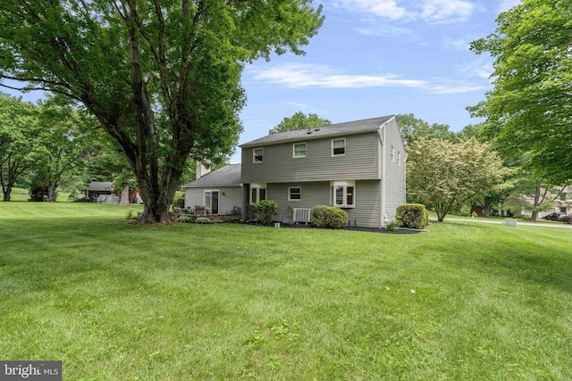 125 Christine Dr, Downingtown, PA 19335 - rear view of property featuring a yard