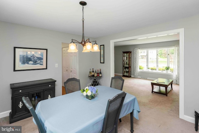 125 Christine Dr, Downingtown, PA 19335 - dining space with light carpet and a chandelier
