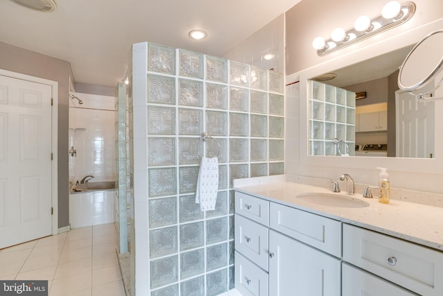 4534 Todd Pt, Sparrows Point, MD 21219 - full bath with vanity, a tile shower, tile patterned floors, and a tub