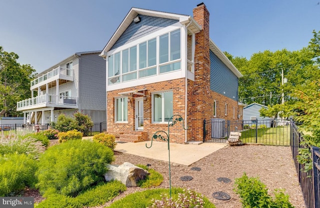 4534 Todd Pt, Sparrows Point, MD 21219 - back of property featuring a chimney and brick siding