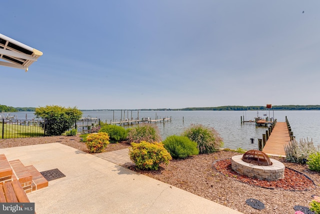 4534 Todd Pt, Sparrows Point, MD 21219 - view of patio with a dock, boat lift, an outdoor fire pit, and a water view