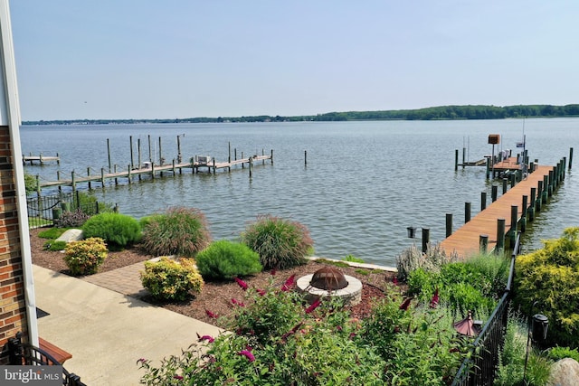 4534 Todd Pt, Sparrows Point, MD 21219 - dock area featuring an outdoor fire pit, a water view, and boat lift