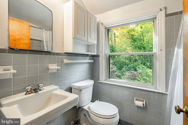 73 Duncan Ln, Springfield, PA 19064 - bathroom with tile walls, plenty of natural light, and a shower with shower curtain