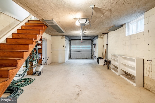 73 Duncan Ln, Springfield, PA 19064 - garage featuring concrete block wall and a garage door opener