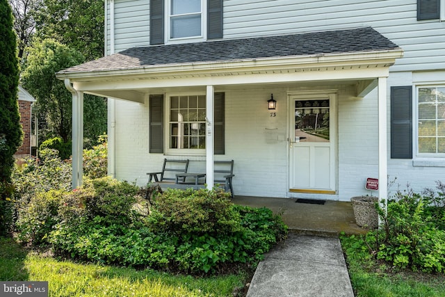 73 Duncan Ln, Springfield, PA 19064 - property entrance with a porch and brick siding
