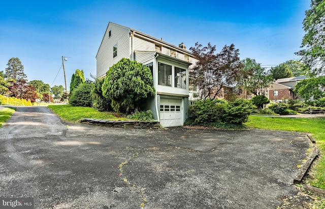 73 Duncan Ln, Springfield, PA 19064 - view of side of home featuring an attached garage