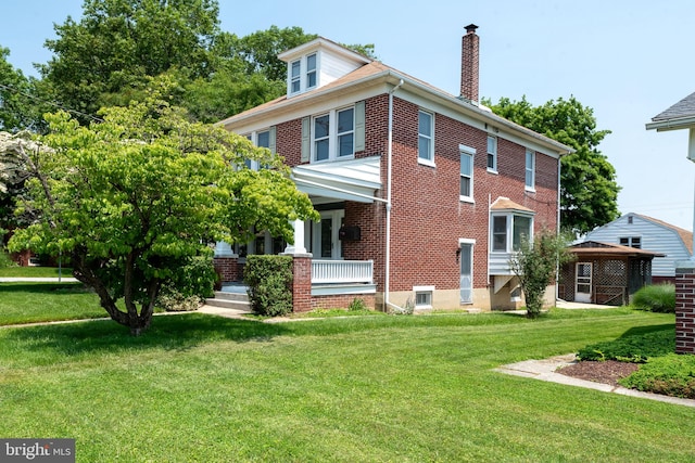 505 S Main St, Red Lion, PA 17356 - view of property exterior featuring brick siding, a chimney, a yard, covered porch, and a gazebo