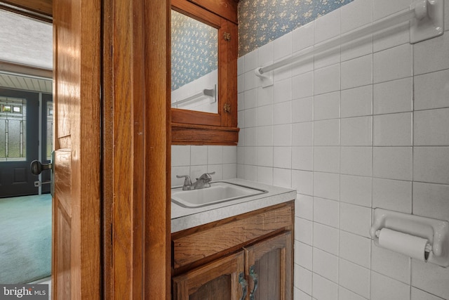 505 S Main St, Red Lion, PA 17356 - half bathroom with tile walls, vanity, and wallpapered walls