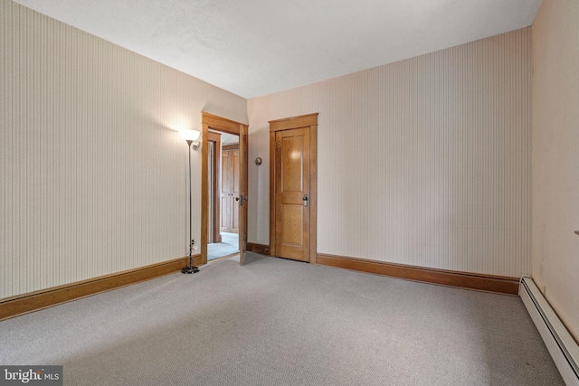 505 S Main St, Red Lion, PA 17356 - carpeted empty room featuring a baseboard heating unit and wallpapered walls