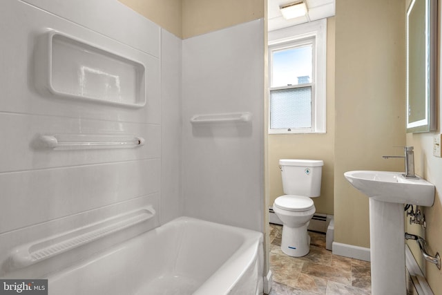 505 S Main St, Red Lion, PA 17356 - bathroom featuring a baseboard heating unit, stone finish flooring, and shower / bath combination