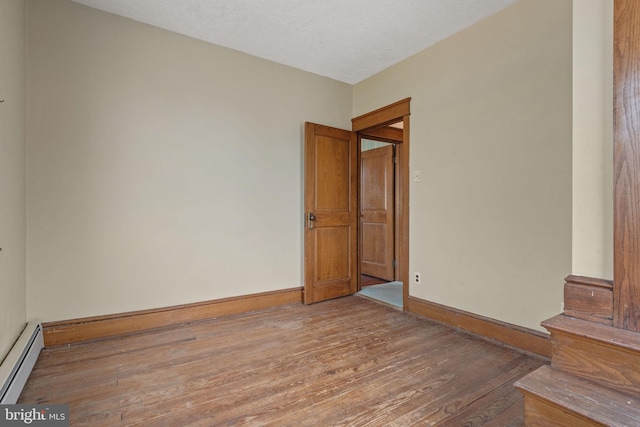 505 S Main St, Red Lion, PA 17356 - spare room with a baseboard radiator and wood finished floors
