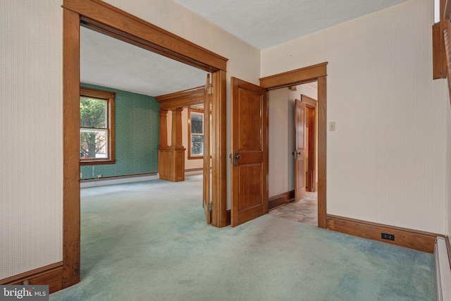 505 S Main St, Red Lion, PA 17356 - carpeted spare room with a baseboard radiator, wallpapered walls, a baseboard heating unit, and a textured ceiling