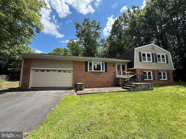 2133 Freda Dr, Vienna, VA 22181 - tri-level home with brick siding, driveway, an attached garage, and a front lawn