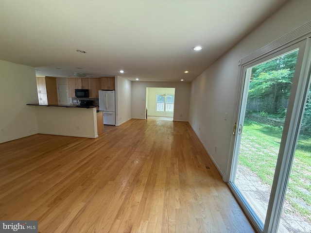 2133 Freda Dr, Vienna, VA 22181 - unfurnished living room with light wood-style floors and recessed lighting