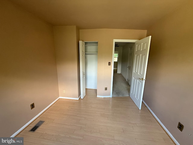 2133 Freda Dr, Vienna, VA 22181 - unfurnished bedroom with light wood-type flooring and a closet