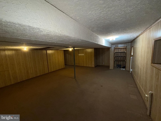 2133 Freda Dr, Vienna, VA 22181 - finished basement featuring a textured ceiling, wooden walls, and carpet flooring
