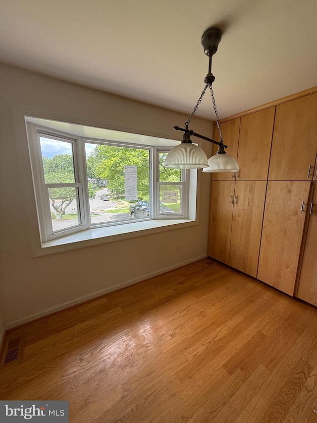 2133 Freda Dr, Vienna, VA 22181 - unfurnished dining area with healthy amount of natural light and light wood finished floors