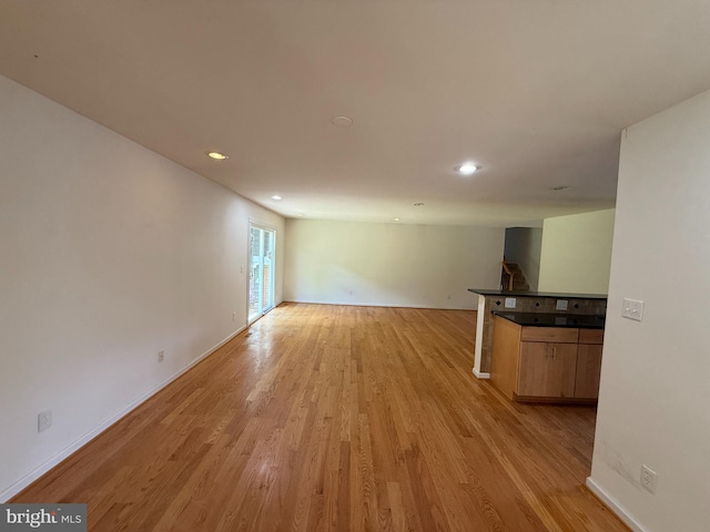 2133 Freda Dr, Vienna, VA 22181 - unfurnished living room with light wood-style flooring and recessed lighting