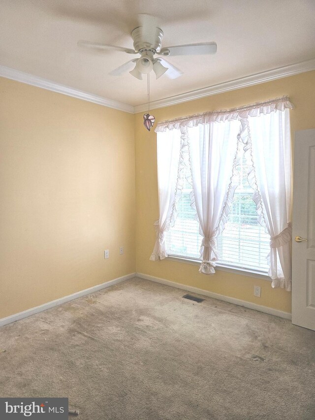 11 Alexandria Ct, Ocean Pines, MD 21811 - carpeted spare room with ornamental molding and a ceiling fan