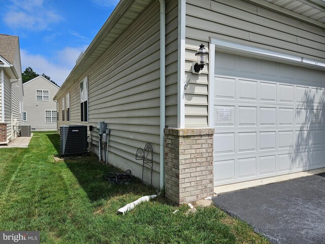 11 Alexandria Ct, Ocean Pines, MD 21811 - view of home's exterior featuring a garage, a lawn, and driveway