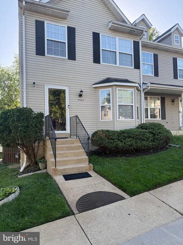 5764 Everhart Pl, Fort Washington, MD 20744 - townhome / multi-family property with a front lawn
