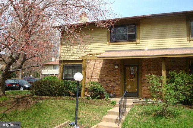 10676 Myrtle Oak Ct, Burke, VA 22015 - view of front facade featuring brick siding and a front lawn