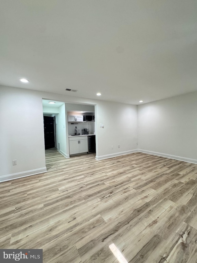 6529 Frietchie Row, Columbia, MD 21045 - unfurnished living room with recessed lighting and light wood-style flooring