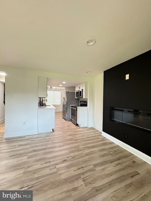6529 Frietchie Row, Columbia, MD 21045 - unfurnished living room with light wood finished floors and recessed lighting