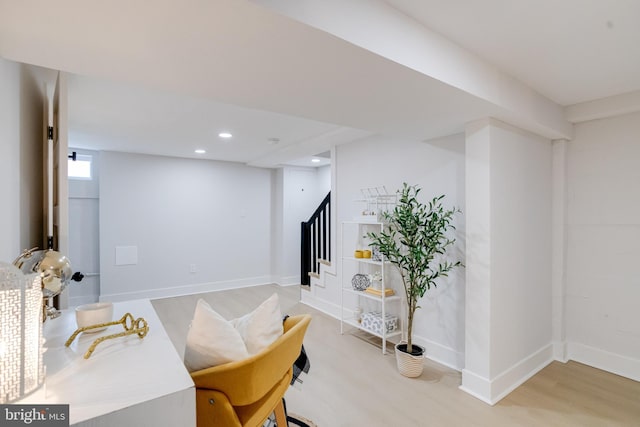4802 Beaufort Ave, Baltimore, MD 21215 - sitting room with light wood-style flooring, stairs, and recessed lighting