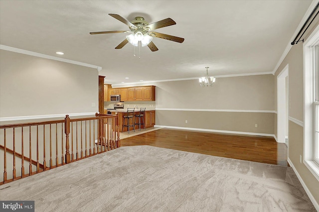 183 Mill Rd, Chambersburg, PA 17201 - unfurnished living room featuring a chandelier, crown molding, a ceiling fan, light wood-style flooring, and recessed lighting