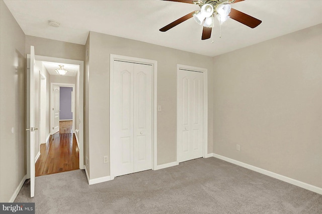 183 Mill Rd, Chambersburg, PA 17201 - unfurnished bedroom with two closets, carpet flooring, and ceiling fan