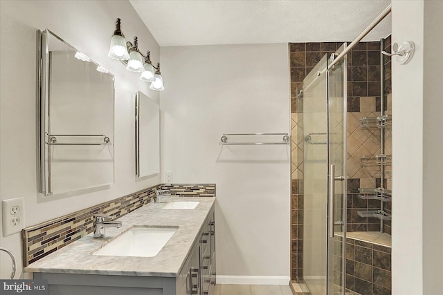 183 Mill Rd, Chambersburg, PA 17201 - bathroom with double vanity, a shower stall, and decorative backsplash
