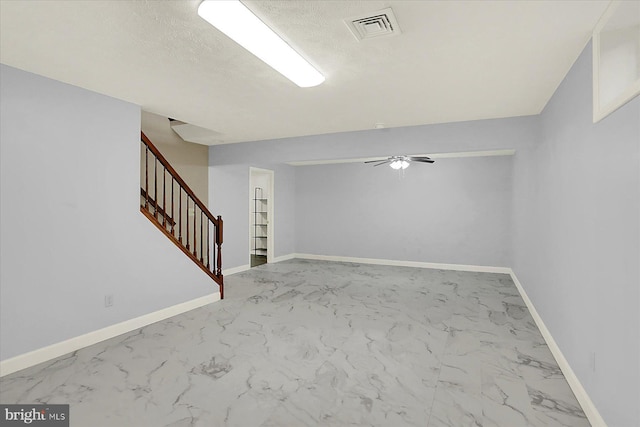 183 Mill Rd, Chambersburg, PA 17201 - finished below grade area with marble look tiles, stairs, and ceiling fan