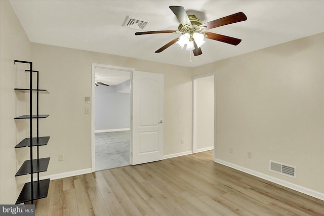 183 Mill Rd, Chambersburg, PA 17201 - unfurnished bedroom with wood finished floors, a spacious closet, and a ceiling fan