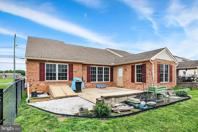 183 Mill Rd, Chambersburg, PA 17201 - rear view of property with brick siding, a patio area, a fenced backyard, and a shingled roof