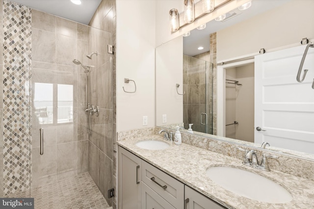220 25th St Unit D, Ocean City, MD 21842 - full bathroom with a shower stall, double vanity, a spacious closet, and recessed lighting