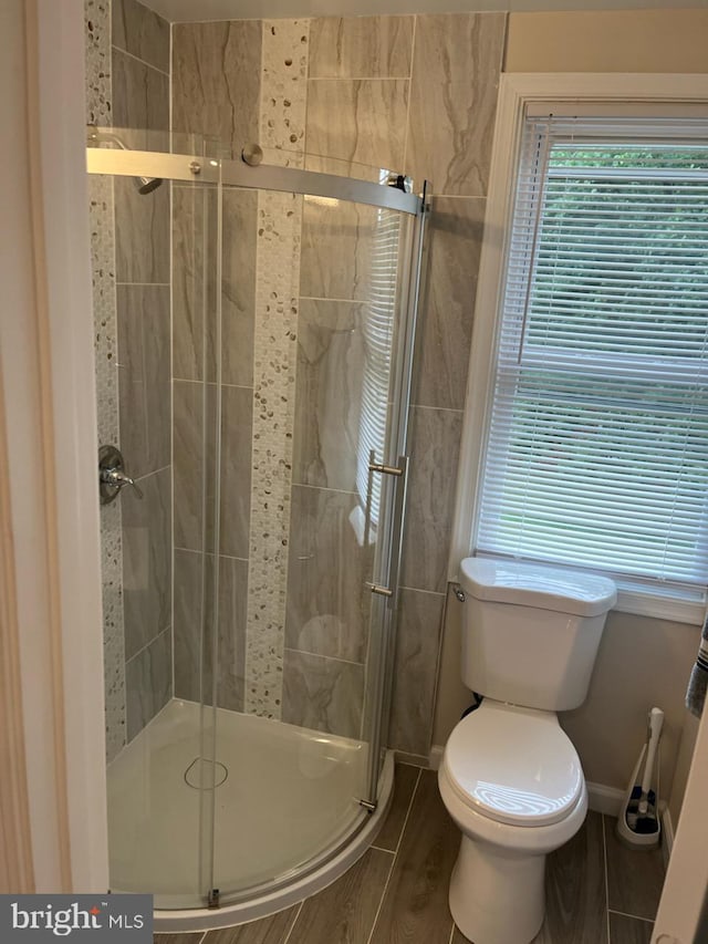 5511 Wesley Ave, Baltimore, MD 21207 - bathroom with a shower stall and wood finished floors